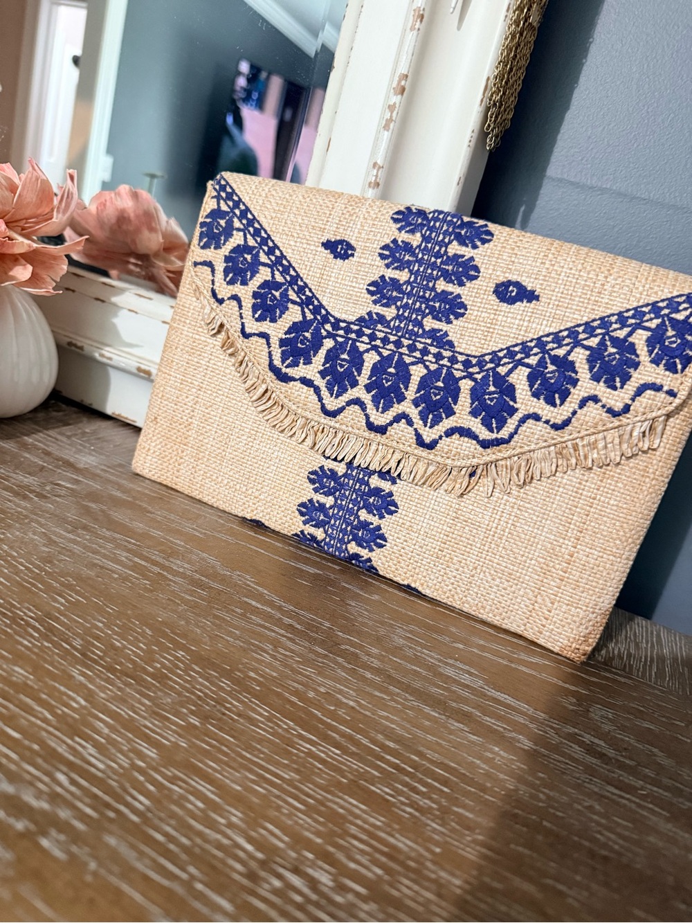 Stella & Dot clutch. Blue and Rattan color. Gorgeous print inside with pockets.